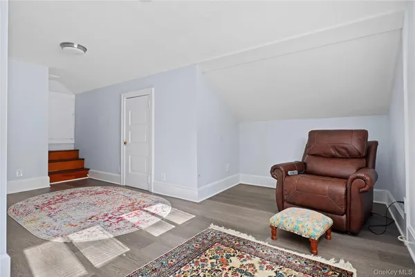 a living room with furniture and a rug