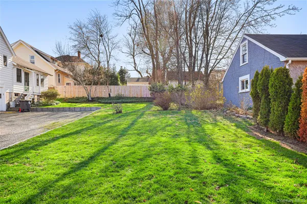 a backyard of a house with lots of green space