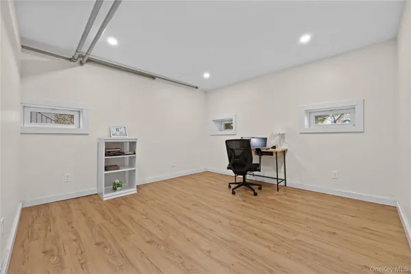 a view of a workspace with furniture