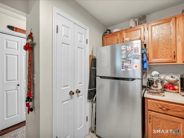 a white refrigerator freezer sitting inside of a kitchen