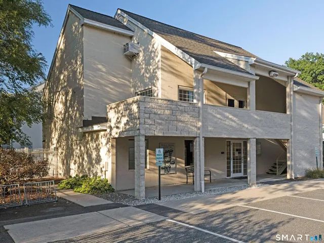 a front view of a house with a porch