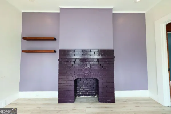 a fireplace with a wooden bench