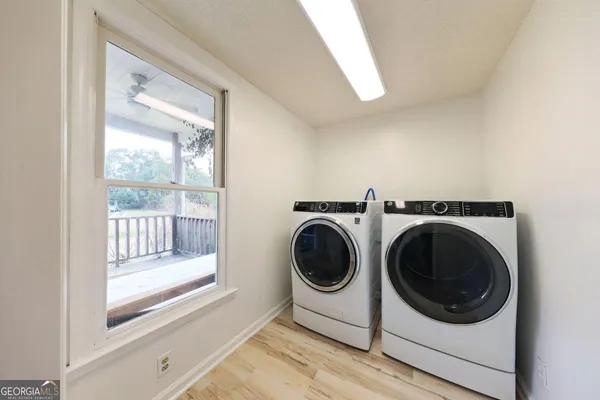 a utility room with dryer and washer