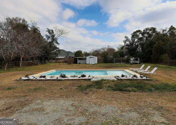 a bedroom with a large bed and a large window