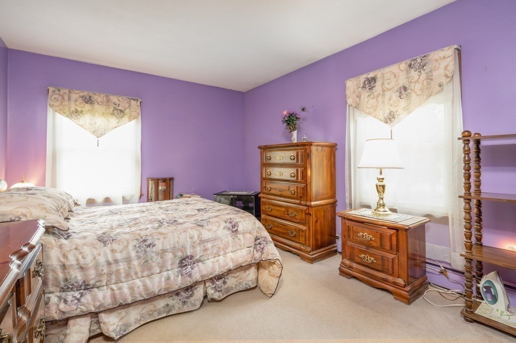 449 Springfield Street Palmer, MA 01069 - Photo 16 of 37 a bedroom with a bed and a dresser in it