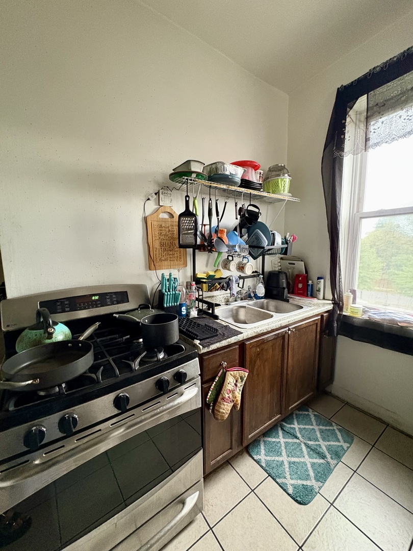 3113 West Roosevelt Road Chicago, IL 60612 - Photo 7 of 11 a kitchen with a sink and cabinets