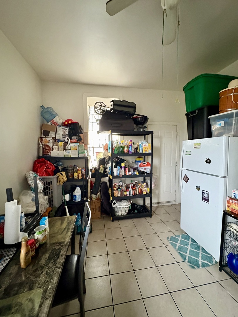 3113 West Roosevelt Road Chicago, IL 60612 - Photo 8 of 11 a garage with a baby crib and a couch