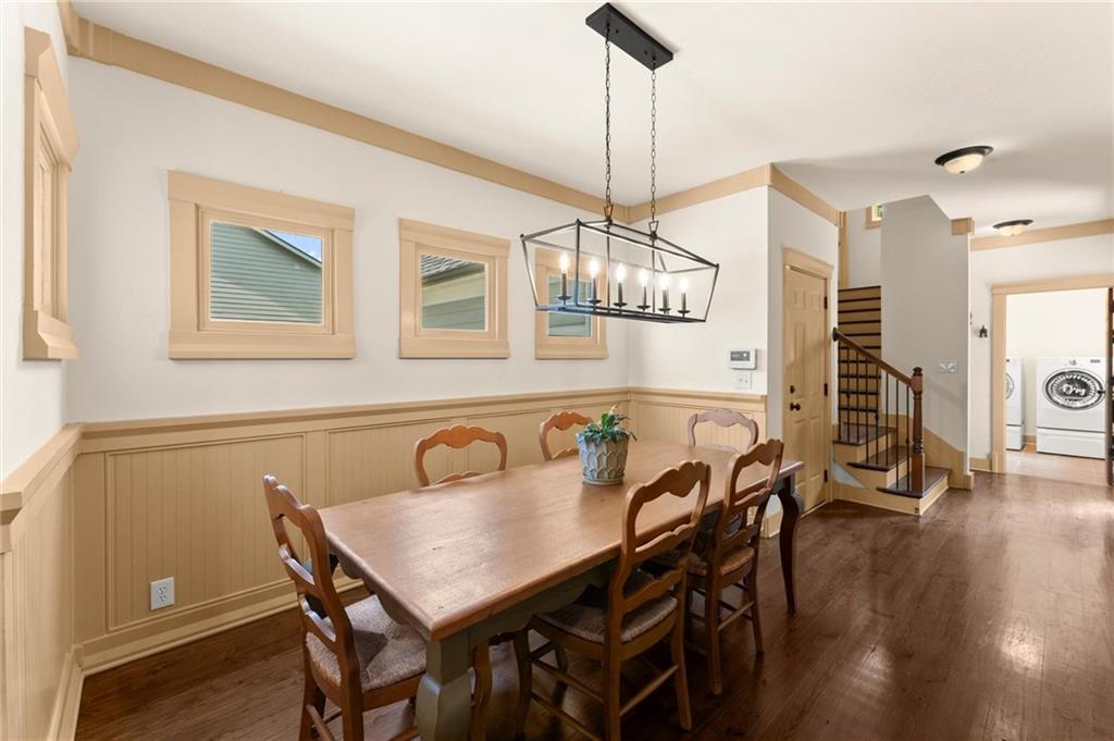 487 Carmichael Circle Canton, GA 30115 - Photo 14 of 65 a view of a dining room with furniture wooden floor and chandelier