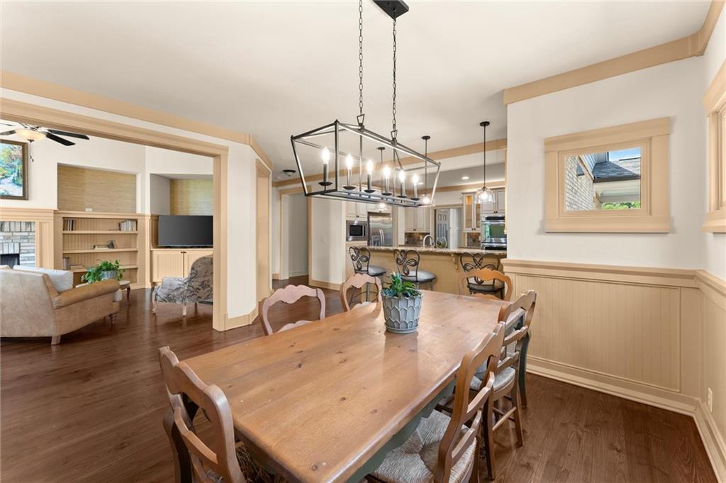 487 Carmichael Circle Canton, GA 30115 - Photo 15 of 65 a dining room with furniture and wooden floor