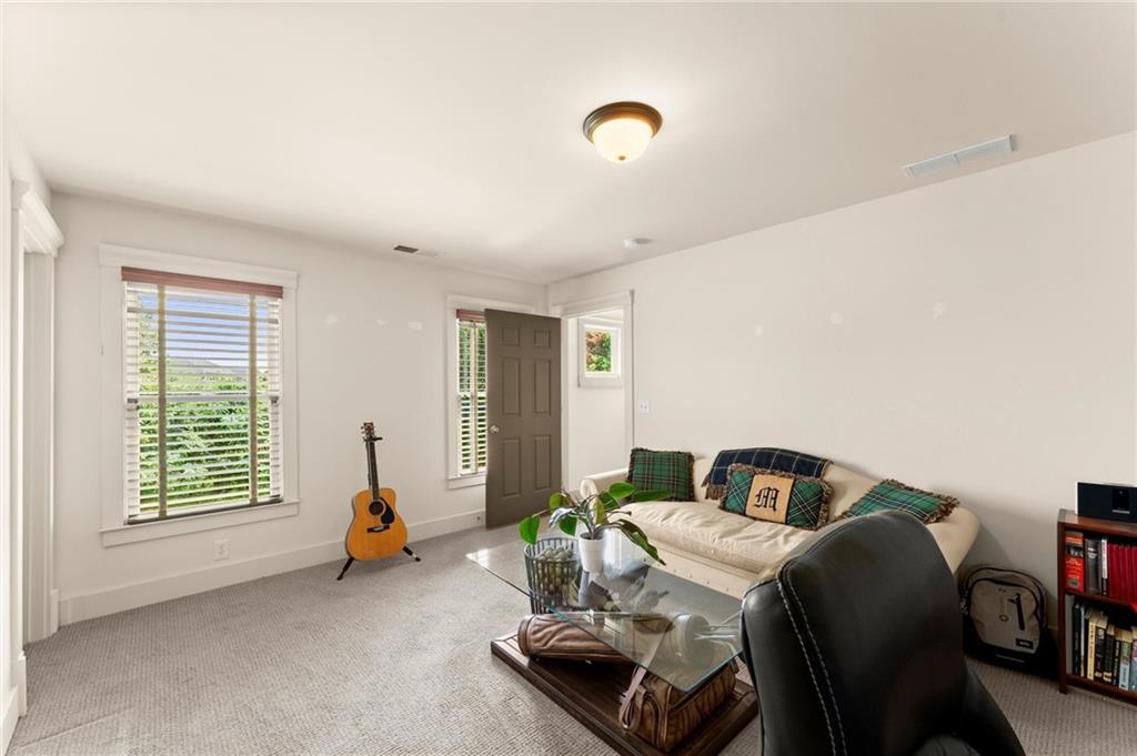 487 Carmichael Circle Canton, GA 30115 - Photo 21 of 65 a bedroom with furniture and a window