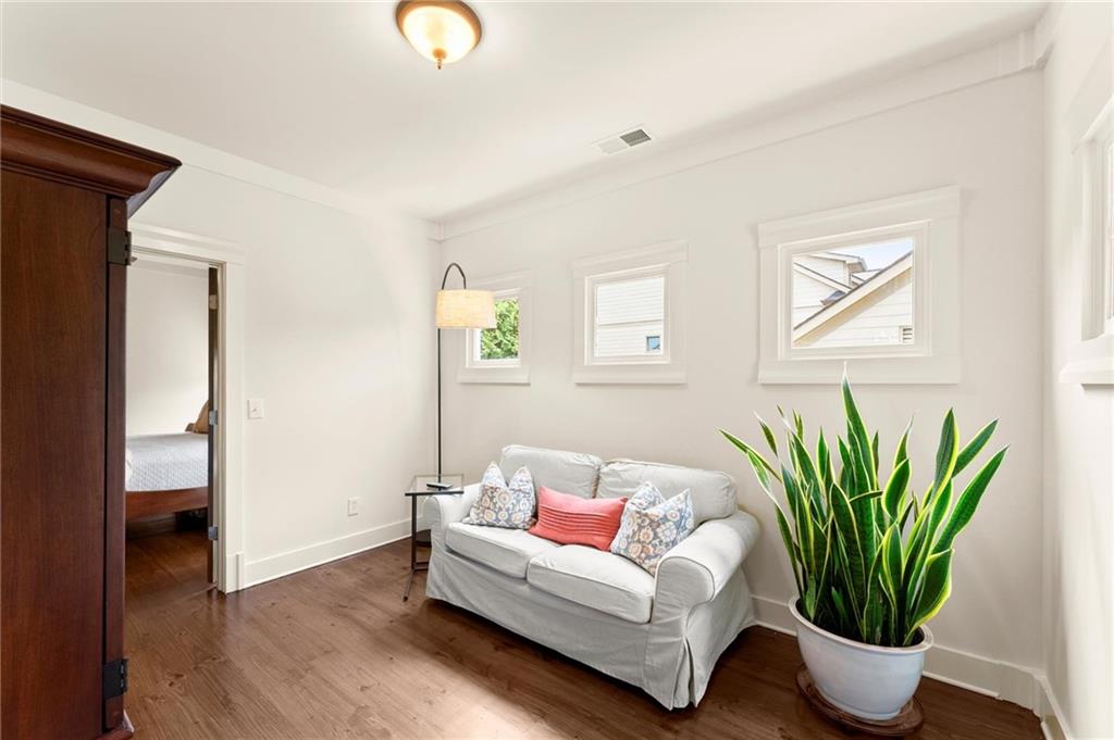 487 Carmichael Circle Canton, GA 30115 - Photo 24 of 65 a living room with furniture potted plant and a window