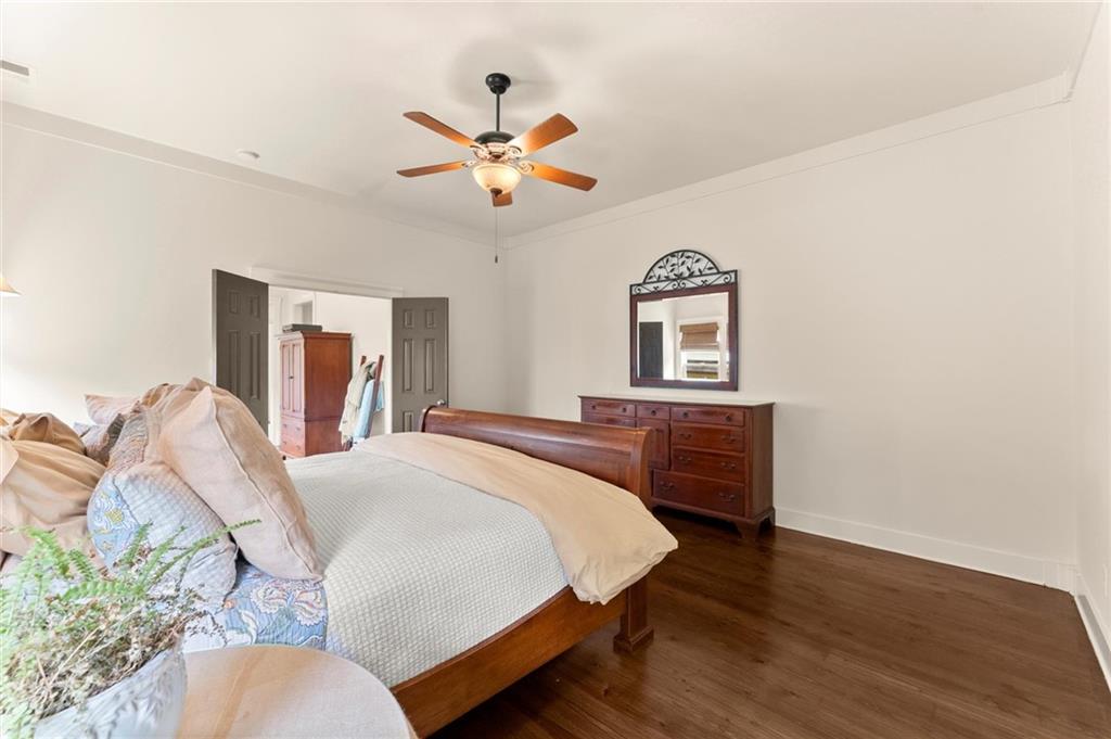 487 Carmichael Circle Canton, GA 30115 - Photo 29 of 65 a bedroom with a bed and a chandelier