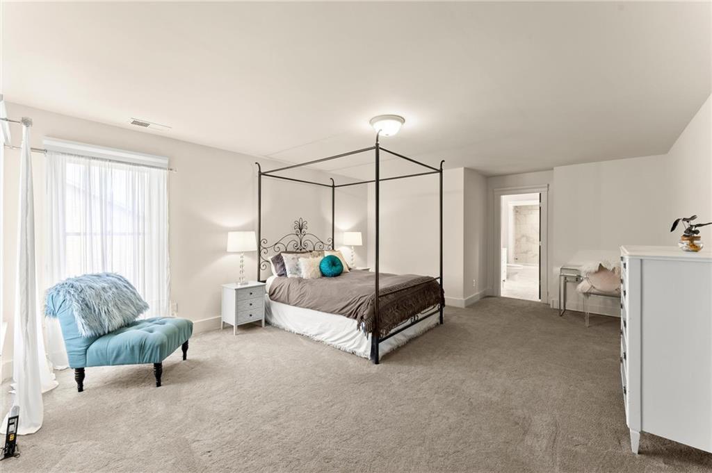 487 Carmichael Circle Canton, GA 30115 - Photo 40 of 65 a living room with furniture and a window