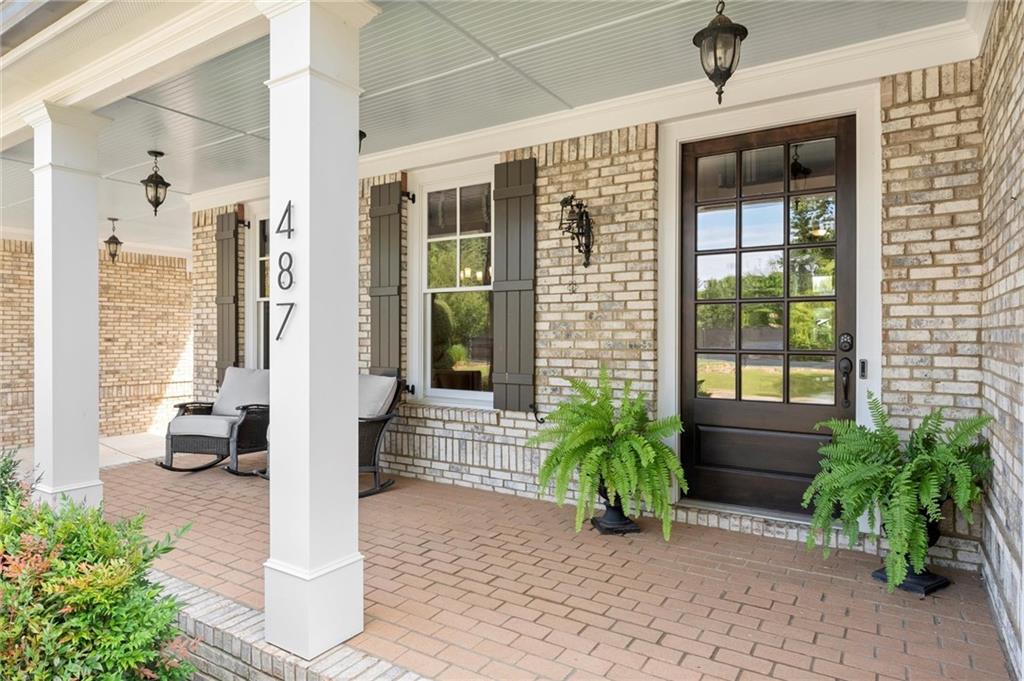 487 Carmichael Circle Canton, GA 30115 - Photo 4 of 65 a front view of a house with a yard
