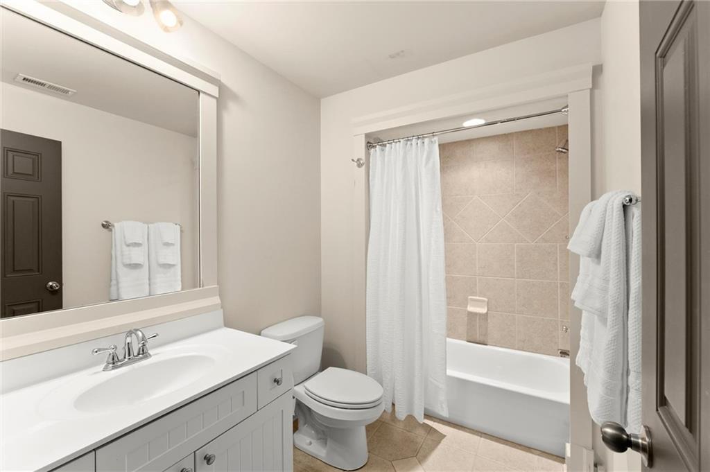 487 Carmichael Circle Canton, GA 30115 - Photo 46 of 65 a bathroom with a sink toilet and shower