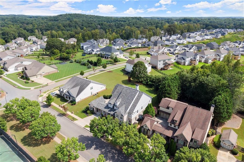 487 Carmichael Circle Canton, GA 30115 - Photo 61 of 65 an aerial view of a swimming pool with outdoor seating and mountain view