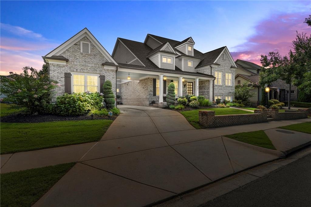 487 Carmichael Circle Canton, GA 30115 - Photo 62 of 65 a front view of a house with a yard