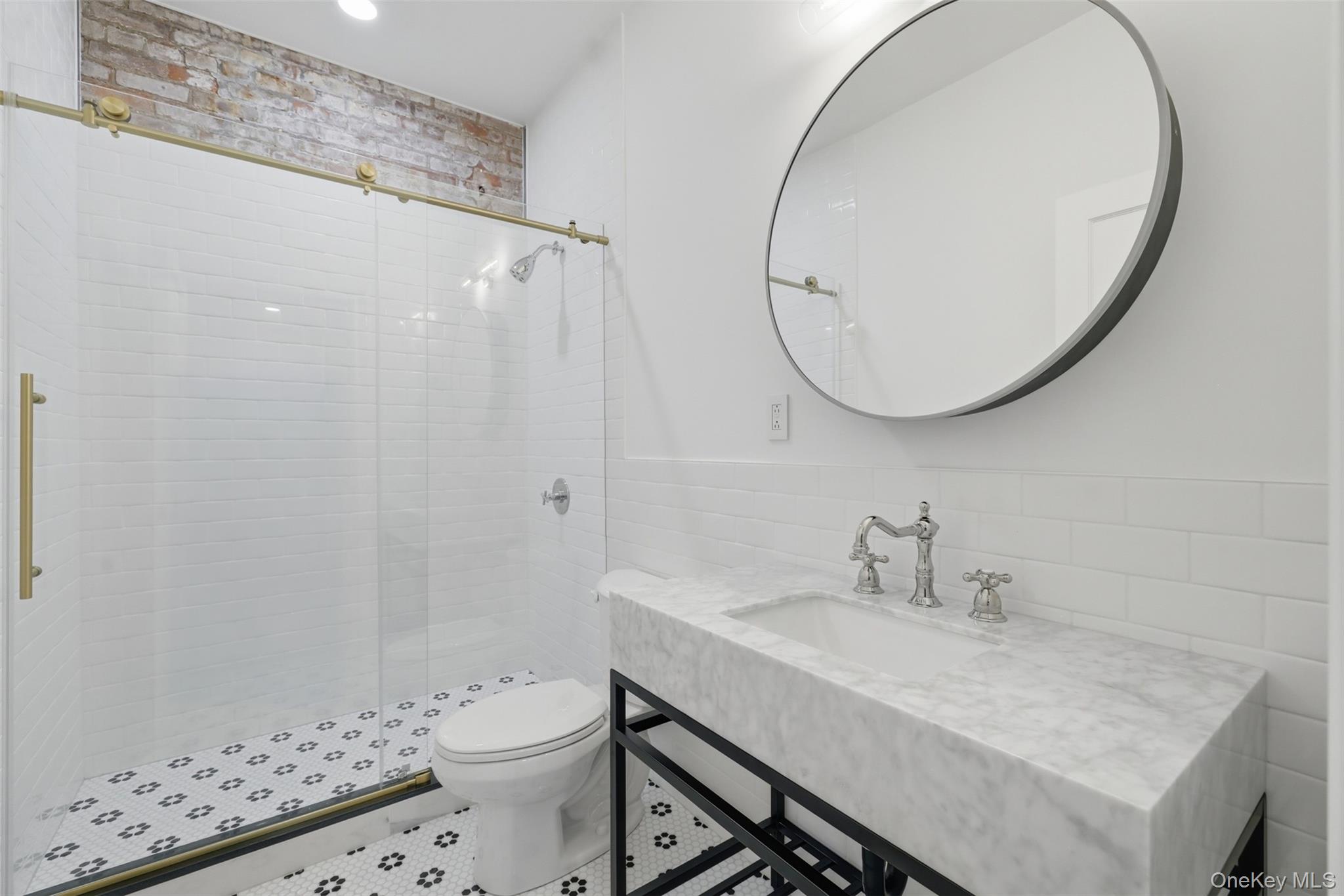 207 Main Street, Unit 5 Beacon, NY 12508 - Photo 12 of 20 a bathroom with a sink a toilet and a mirror