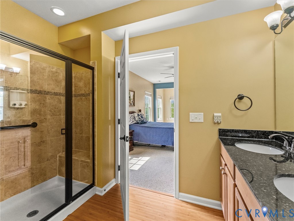14000 Briars Circle, Unit 304 Midlothian, VA 23114 - Photo 21 of 27 a view of a bathroom with a tub and shower