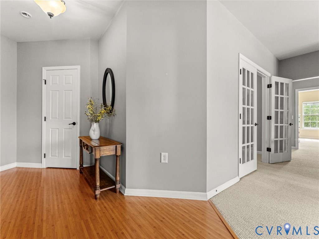 14000 Briars Circle, Unit 304 Midlothian, VA 23114 - Photo 3 of 27 a view of a room with wooden floor and furniture