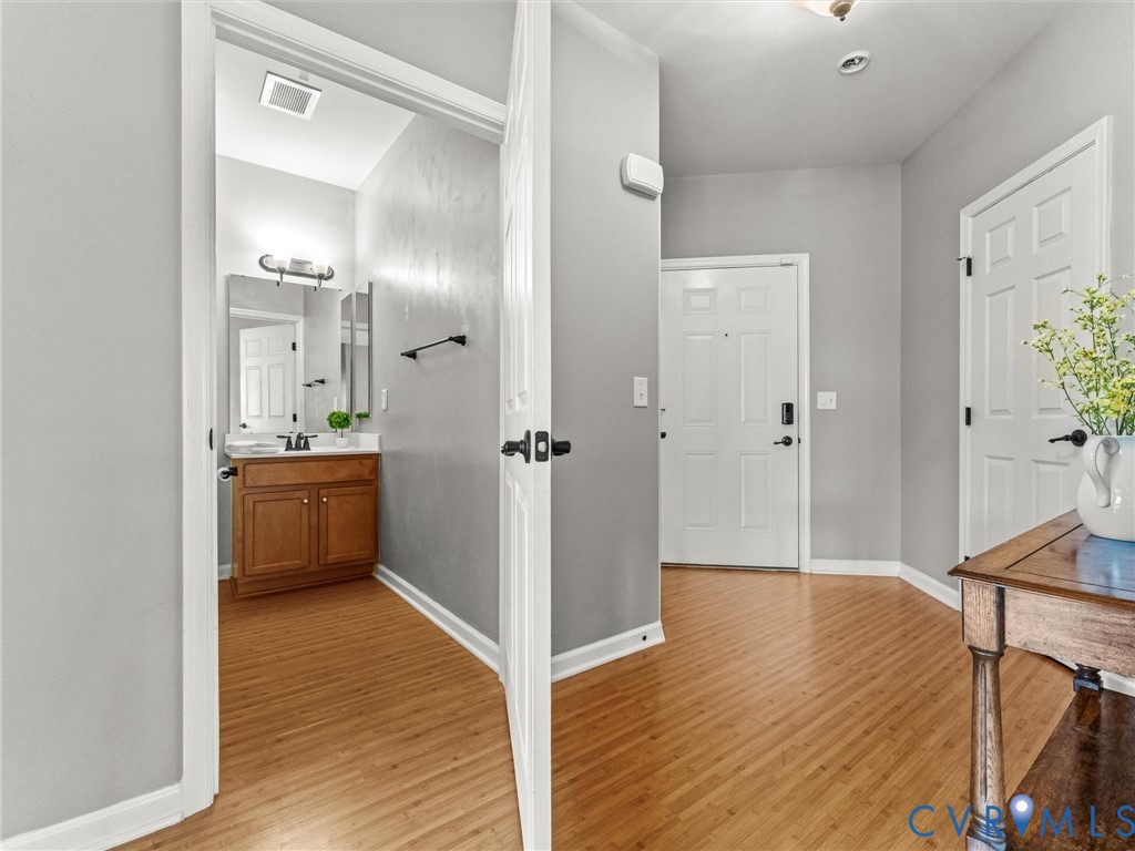 14000 Briars Circle, Unit 304 Midlothian, VA 23114 - Photo 4 of 27 a bathroom with a sink and a mirror