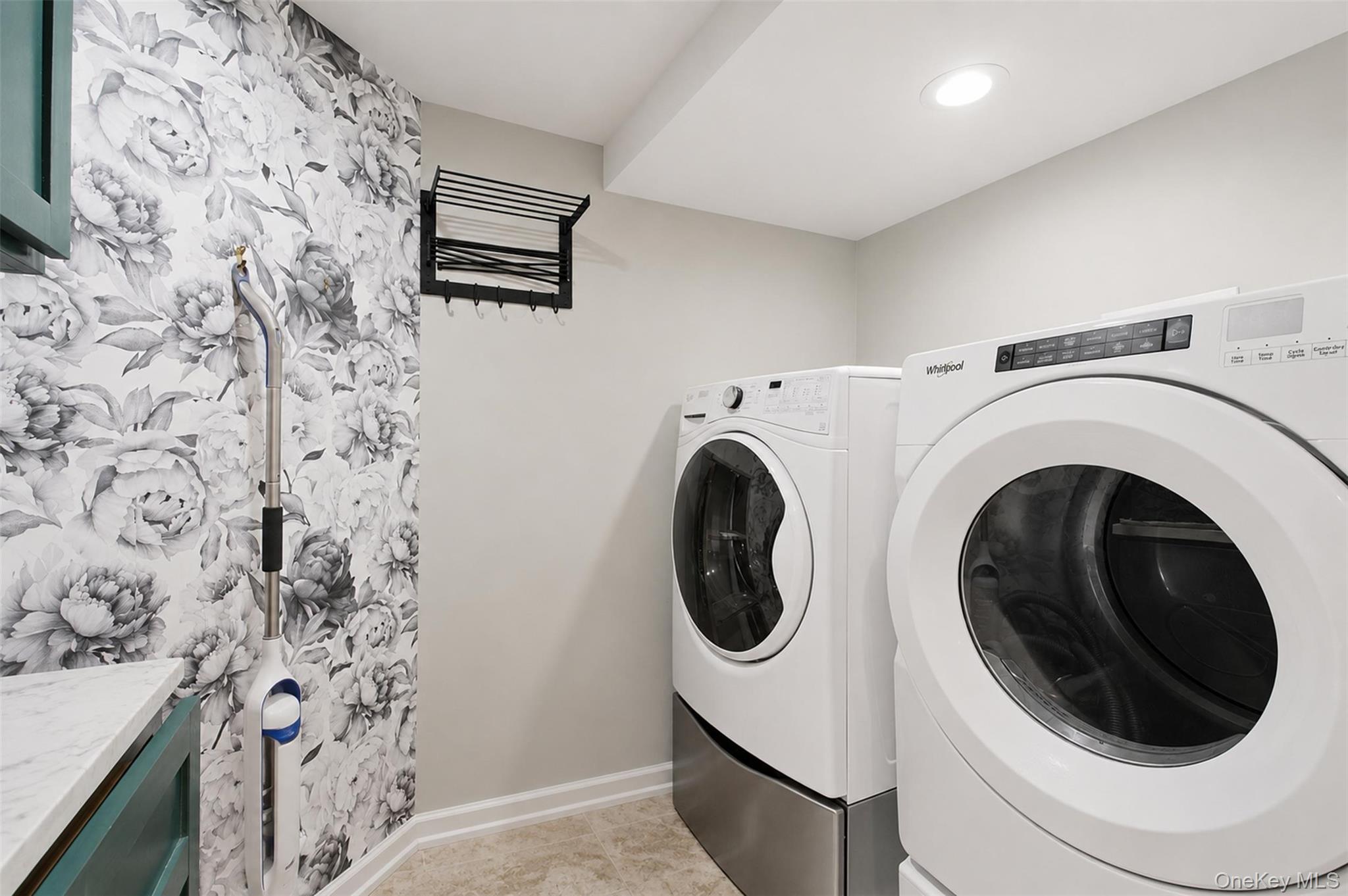 12 Leeside Road Carmel, NY 10512 - Photo 32 of 44 Dedicated laundry area featuring a front-load washer and dryer set on pedestals, recessed lighting, patterned accent wall, and a folding drying rack