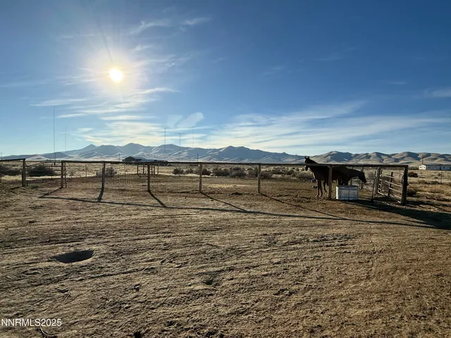a view of a big yard with an outdoor seating