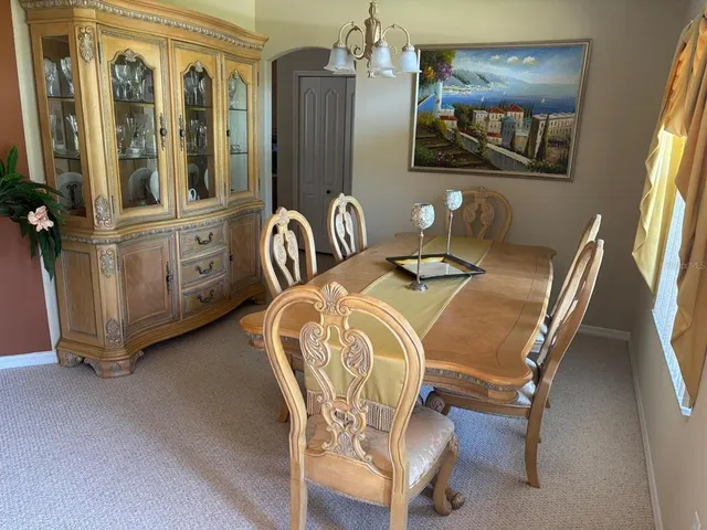 a dining room with furniture and window