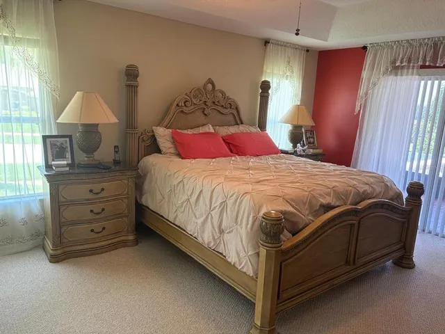 a bedroom with a bed and a mirror