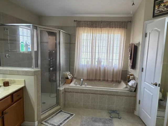 a bathroom with a bathtub and a sink