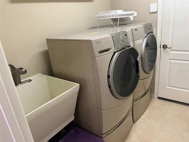 a utility room with dryer and washer