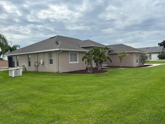 a front view of house with yard and green space