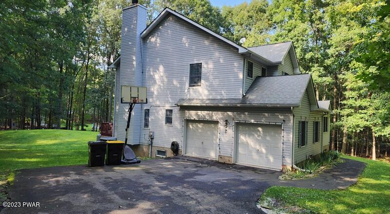 249 Pin Oak Road Stroudsburg, PA 18360 - Photo 2 of 34 a view of a house with backyard and garden