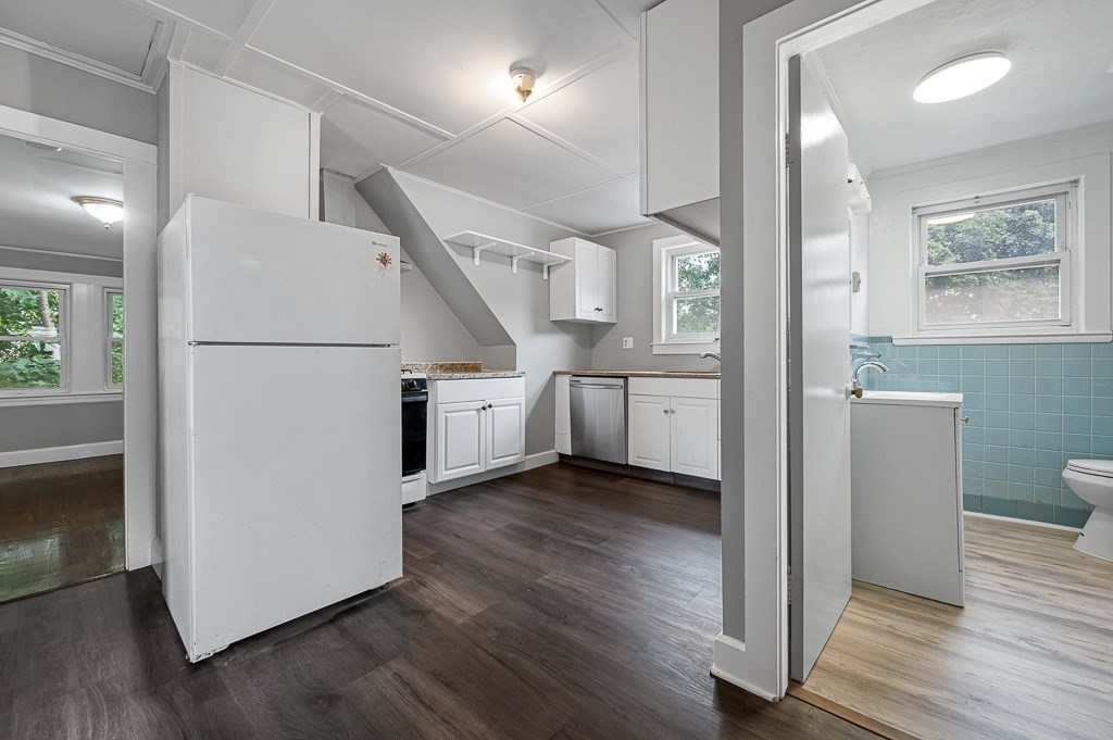 50 Ruggles Street, Unit 3 Franklin, MA 02038 - Photo 1 of 17 a view of a kitchen with wooden floor and electronic appliances