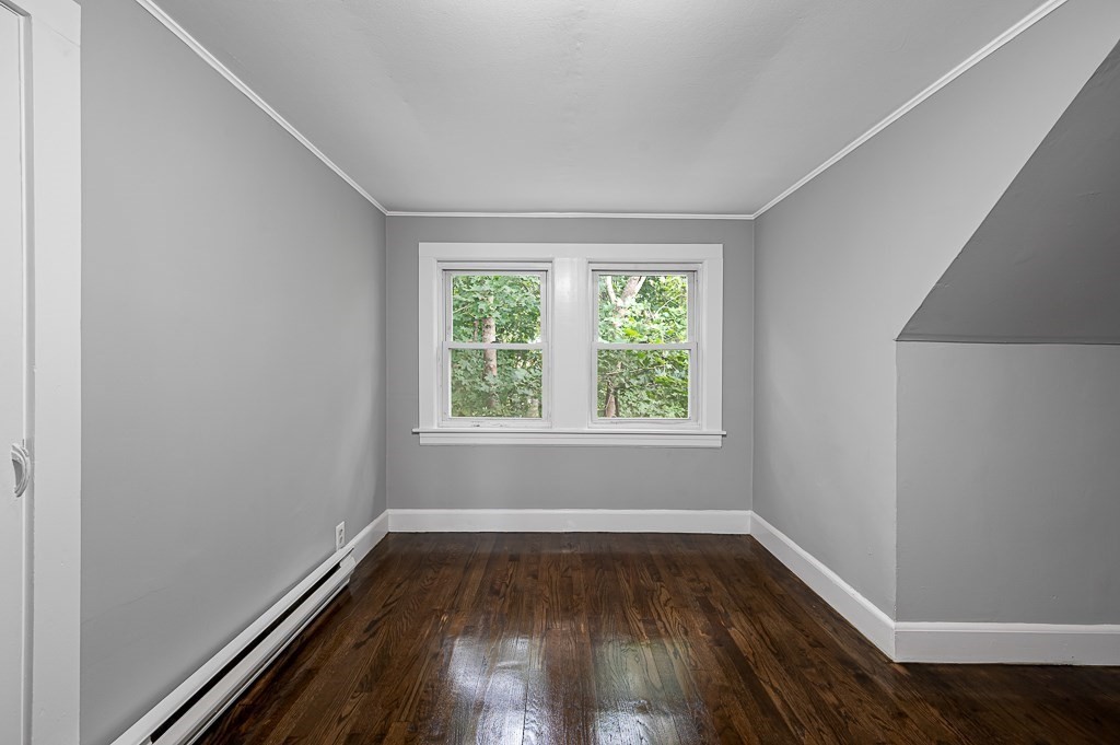 50 Ruggles Street, Unit 3 Franklin, MA 02038 - Photo 11 of 17 an empty room with wooden floor and window