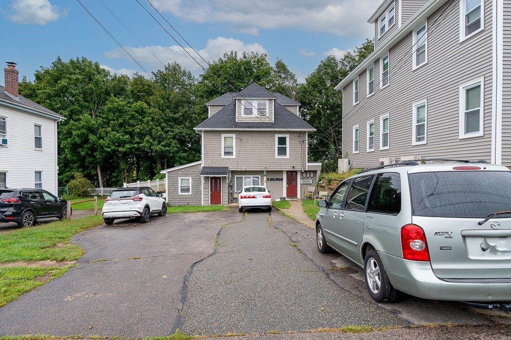 50 Ruggles Street, Unit 3 Franklin, MA 02038 - Photo 13 of 17 a view of a cars parked in front of a house