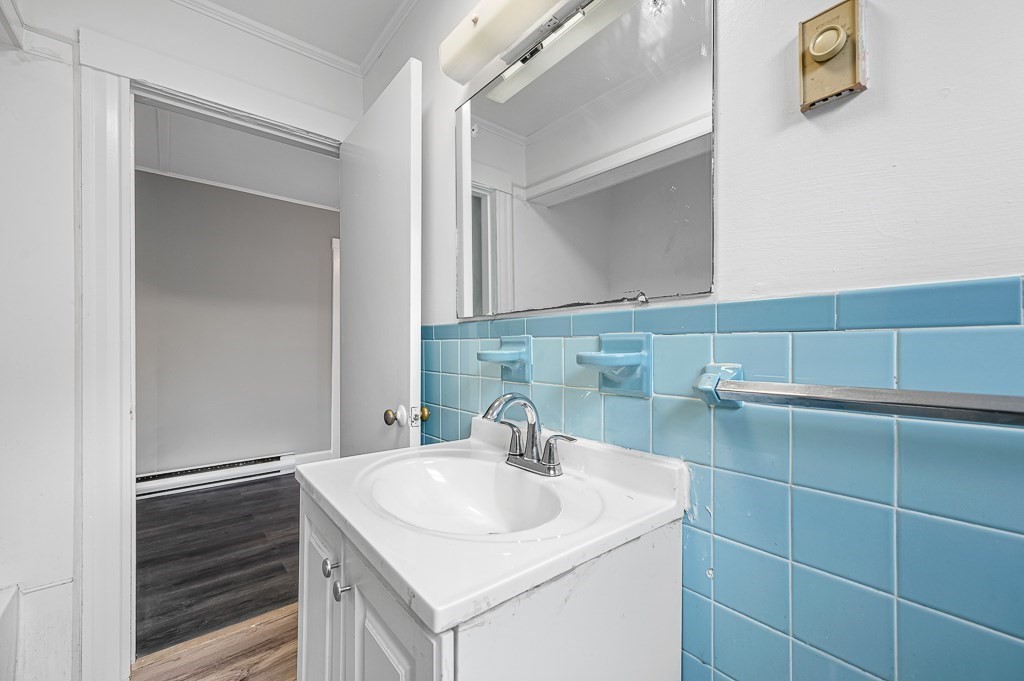 50 Ruggles Street, Unit 3 Franklin, MA 02038 - Photo 6 of 17 a bathroom with a sink and a mirror