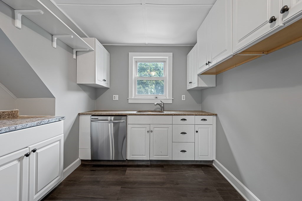 50 Ruggles Street, Unit 3 Franklin, MA 02038 - Photo 7 of 17 a kitchen with granite countertop a sink cabinets window and stainless steel appliances