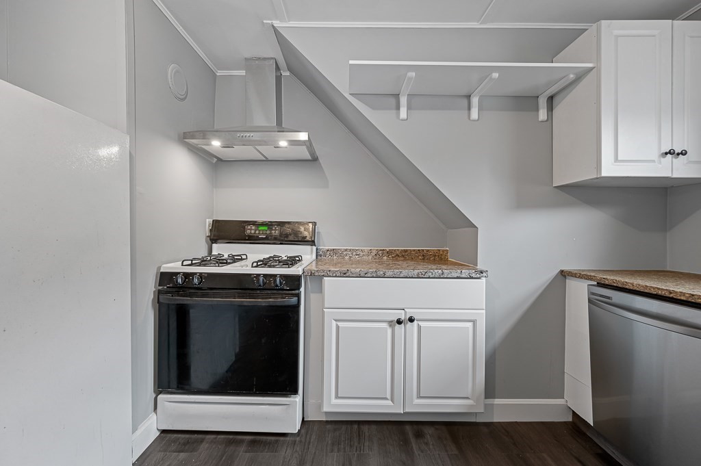 50 Ruggles Street, Unit 3 Franklin, MA 02038 - Photo 8 of 17 a stove top oven sitting inside of a kitchen