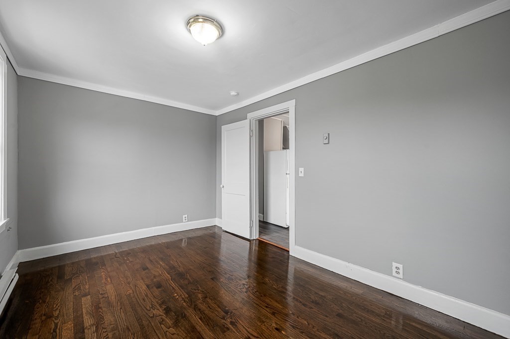50 Ruggles Street, Unit 3 Franklin, MA 02038 - Photo 10 of 17 a view of an empty room with wooden floor