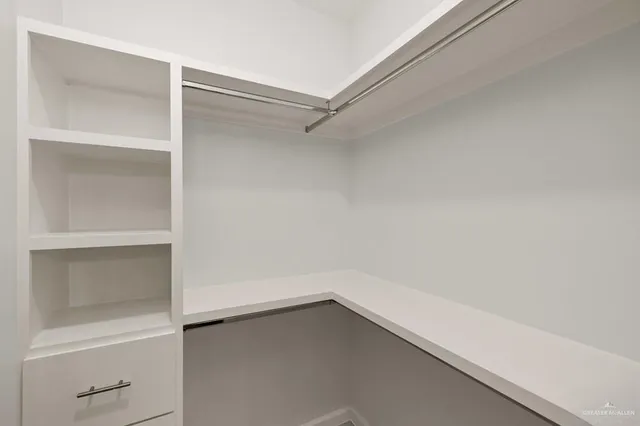 a view of an empty walk in closet