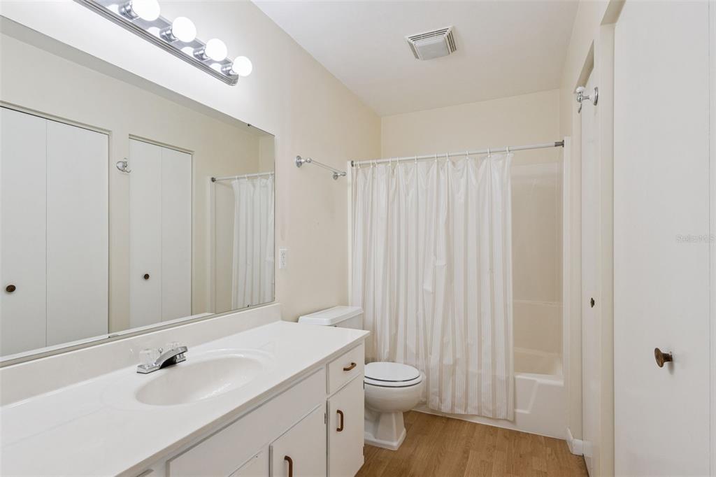 141 Northeast 50th Court Ocala, FL 34470 - Photo 18 of 42 a bathroom with a sink a toilet and shower