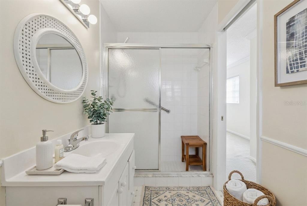 141 Northeast 50th Court Ocala, FL 34470 - Photo 24 of 42 a bathroom with a sink and a mirror