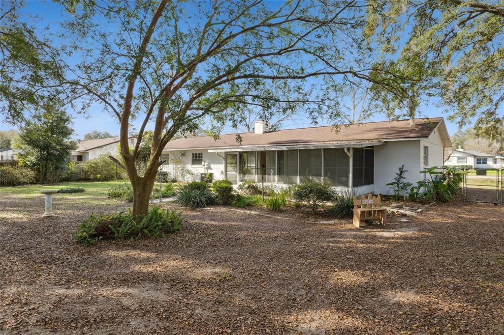 141 Northeast 50th Court Ocala, FL 34470 - Photo 33 of 42 a view of a house with backyard sitting area and garden