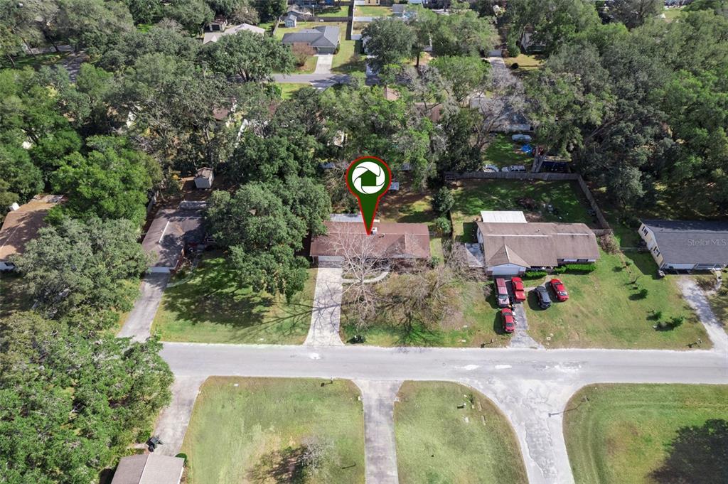 141 Northeast 50th Court Ocala, FL 34470 - Photo 39 of 42 an aerial view of a house with a yard