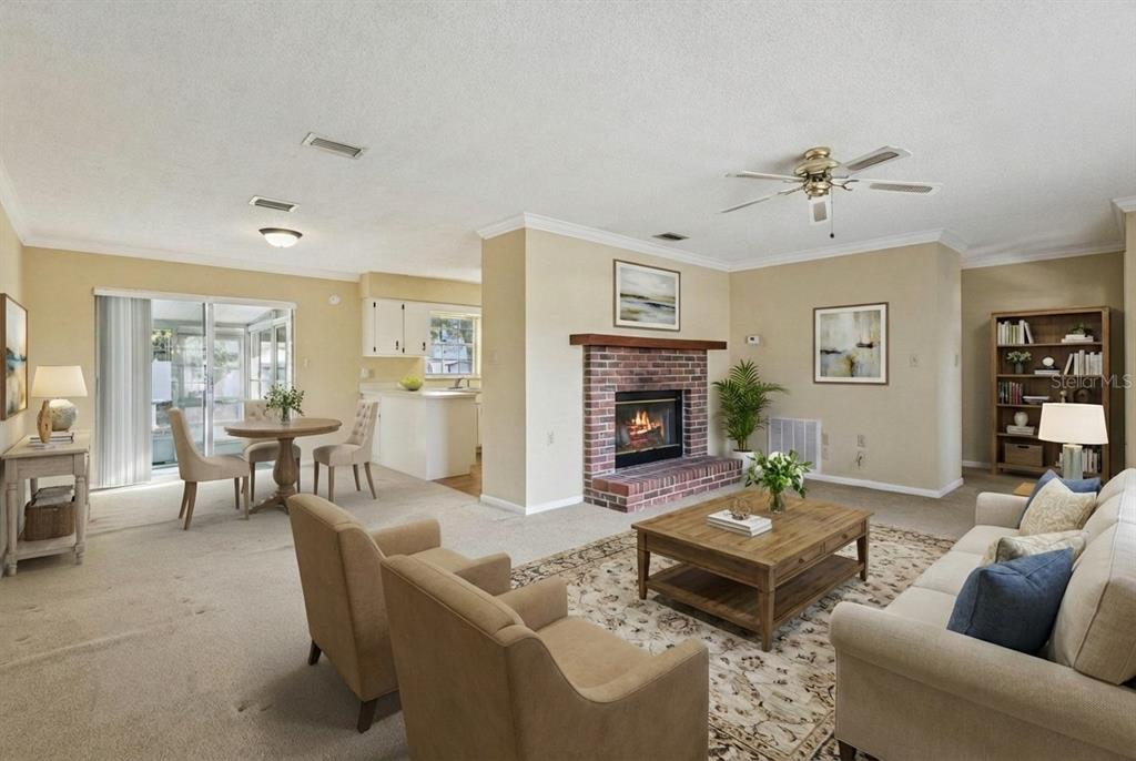 141 Northeast 50th Court Ocala, FL 34470 - Photo 8 of 42 a living room with furniture and a fireplace
