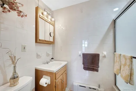 a bedroom with furniture and a flat screen tv
