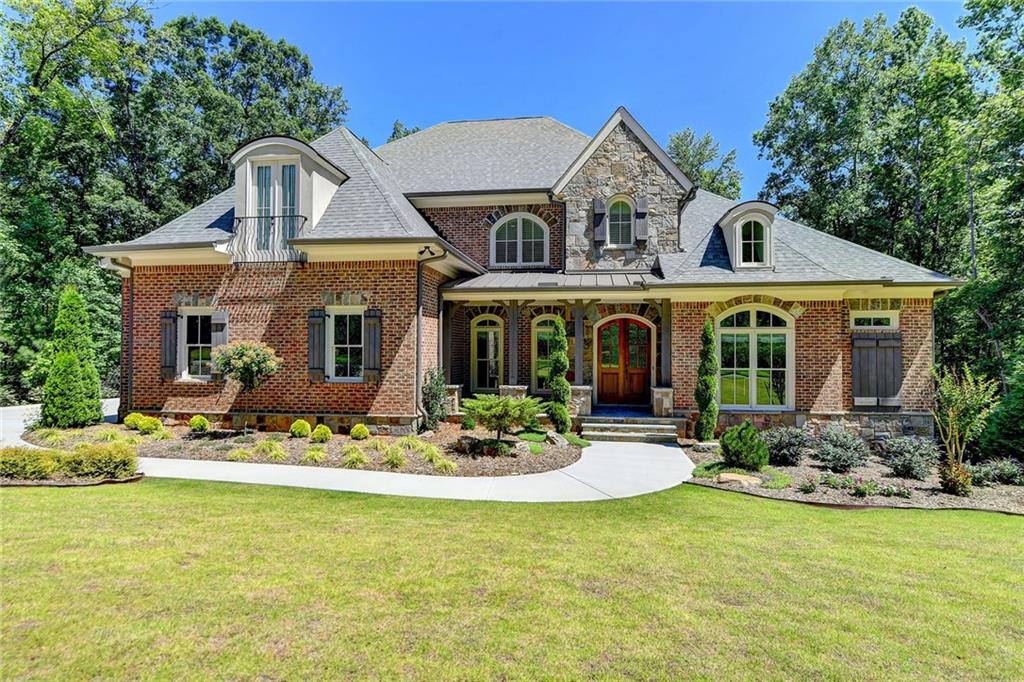 237 Traditions Drive Alpharetta, GA 30004 - Photo 1 of 1 a front view of a house with swimming garden and furniture