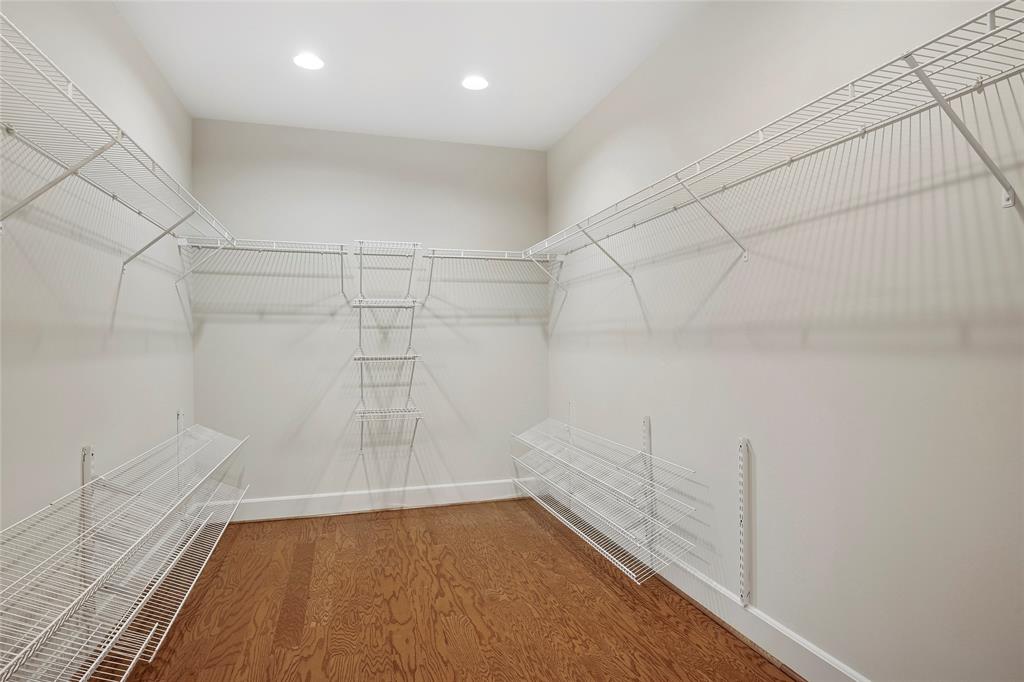 1505 Elm Street, Unit 603 Dallas, TX 75201 - Photo 14 of 36 a view of a room with racks on the wall