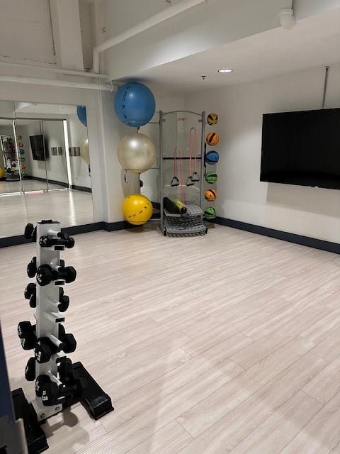 1505 Elm Street, Unit 603 Dallas, TX 75201 - Photo 22 of 36 a view of a room with gym equipment